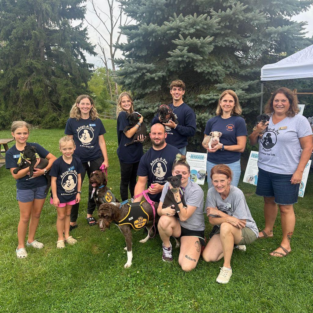 Group from Adopt-a-pet with adoptable dogs