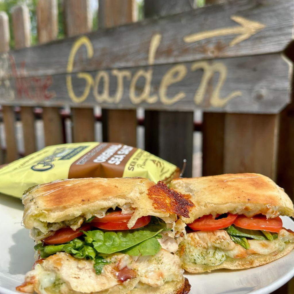 Chicken sandwich and chips on a plate