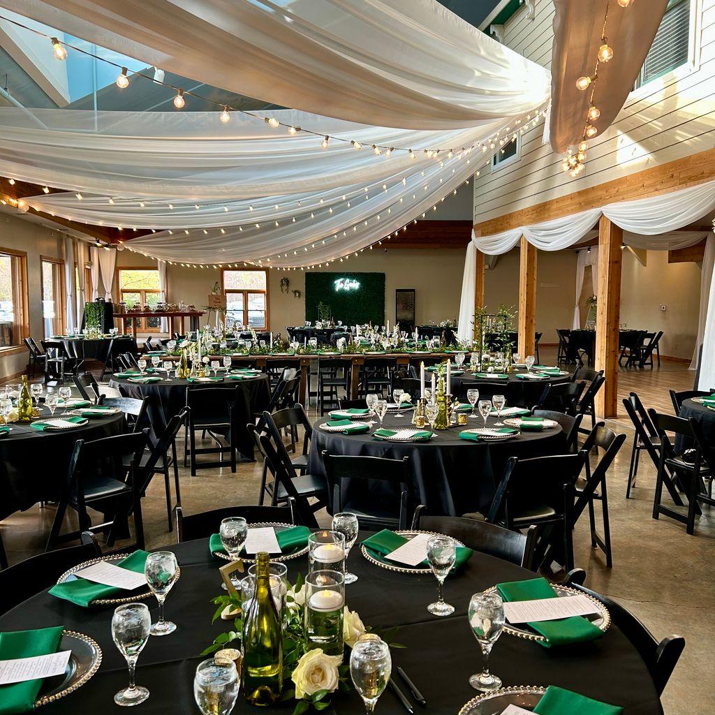 reception set up with black and green linens