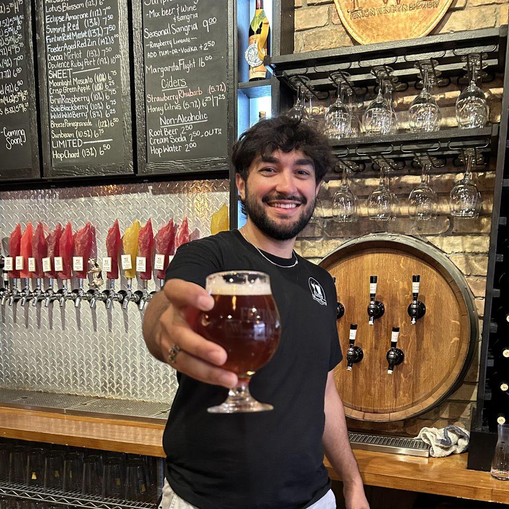 Bartender serving a beer
